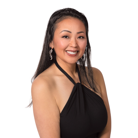 Lana Perhacs, Owner and Photographer at Mystic Image, smiling in a high-key studio portrait.