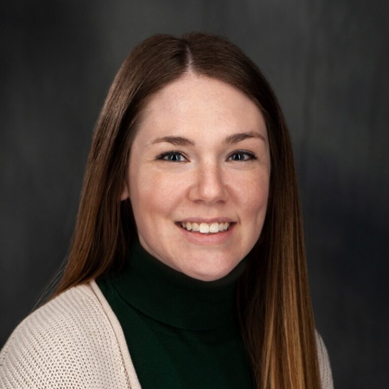 Erin Stewart (Burke), Lead Cinematographer at Mystic Image, smiling in a professional studio headshot.